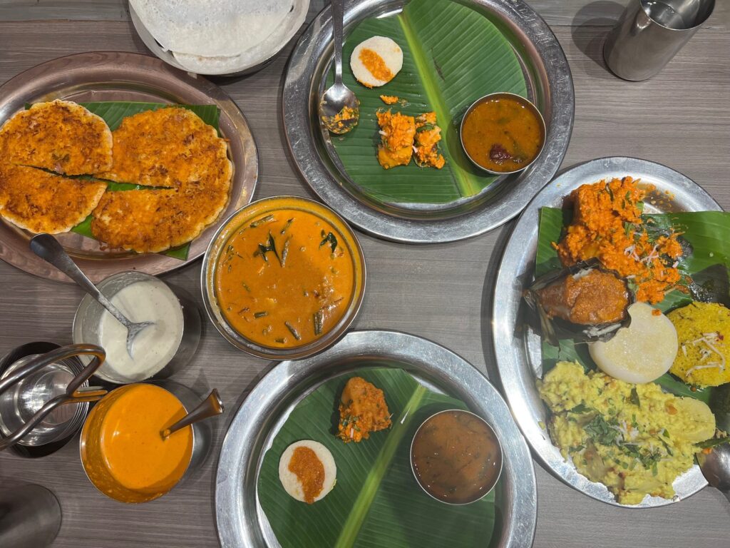 Overhead table shot of food at Banana Leaf, a restaurant in Mumabi