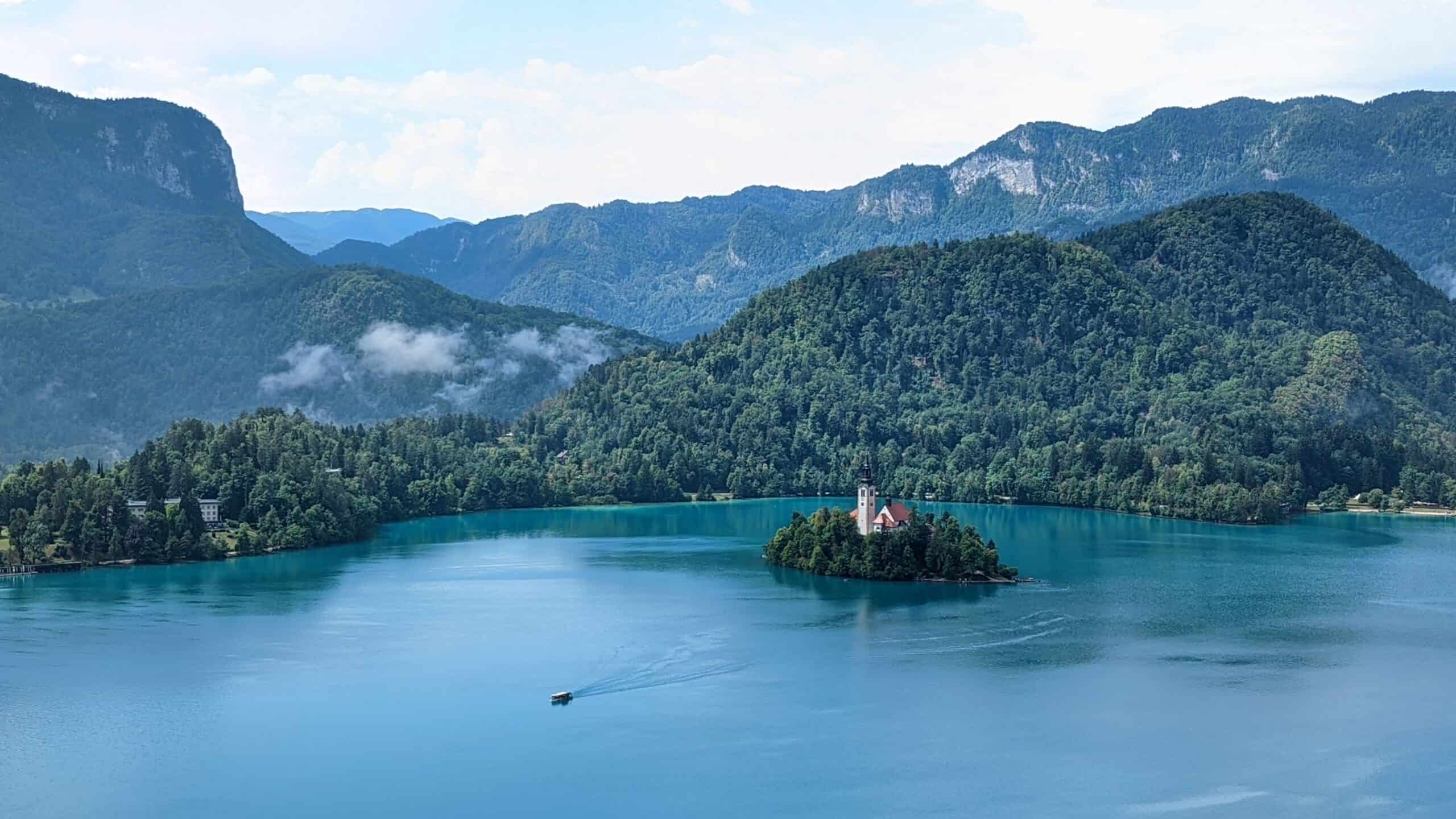 View of Lake Bled and the lush green Alps from Bled Castle terrace.