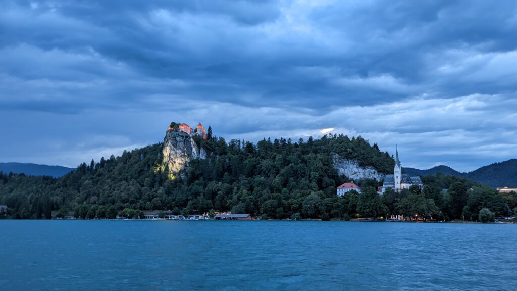 View of Bled Castle from across Lake Bled at night, a top thing to do in Lake Bled