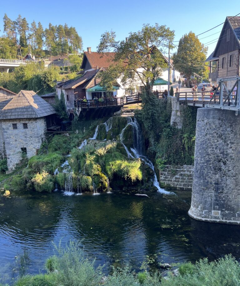 Waterfall on the side of the road in Rastoke, Croatia