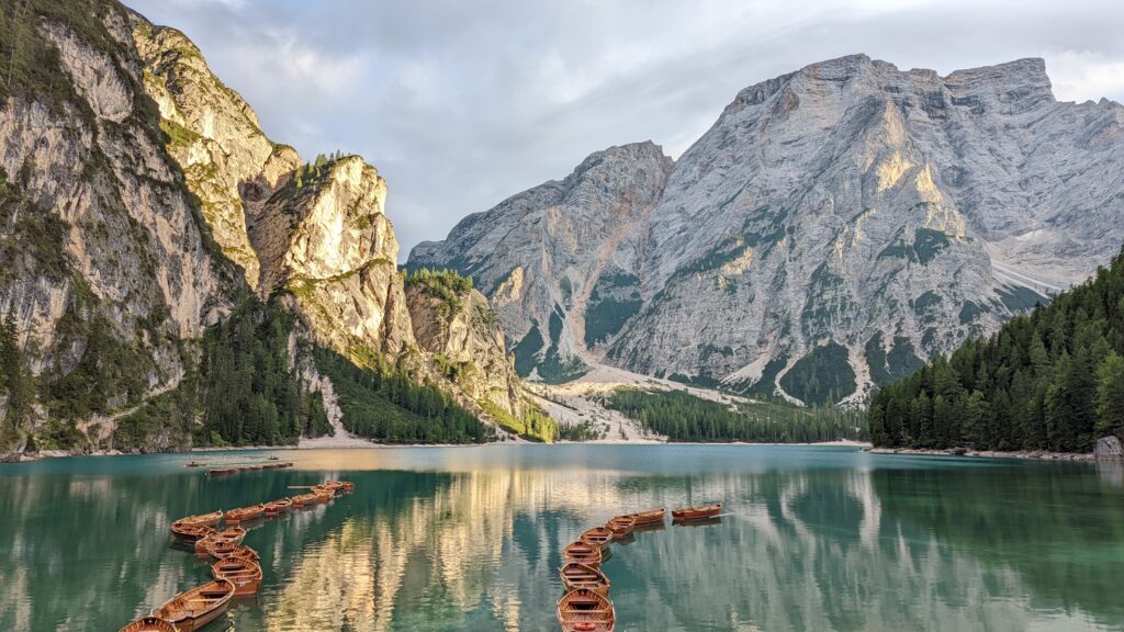 Pragser Wildsee (Lago di Braies) with line of rowboats, a must-see sight in the Dolomites