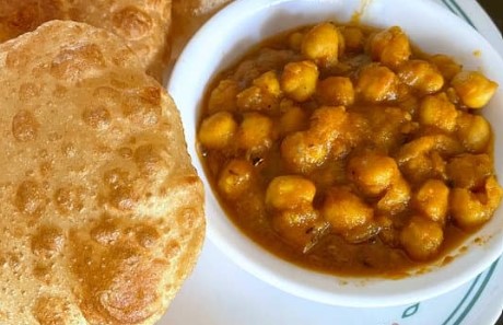 A close up of chole bhature, a must try street food in India