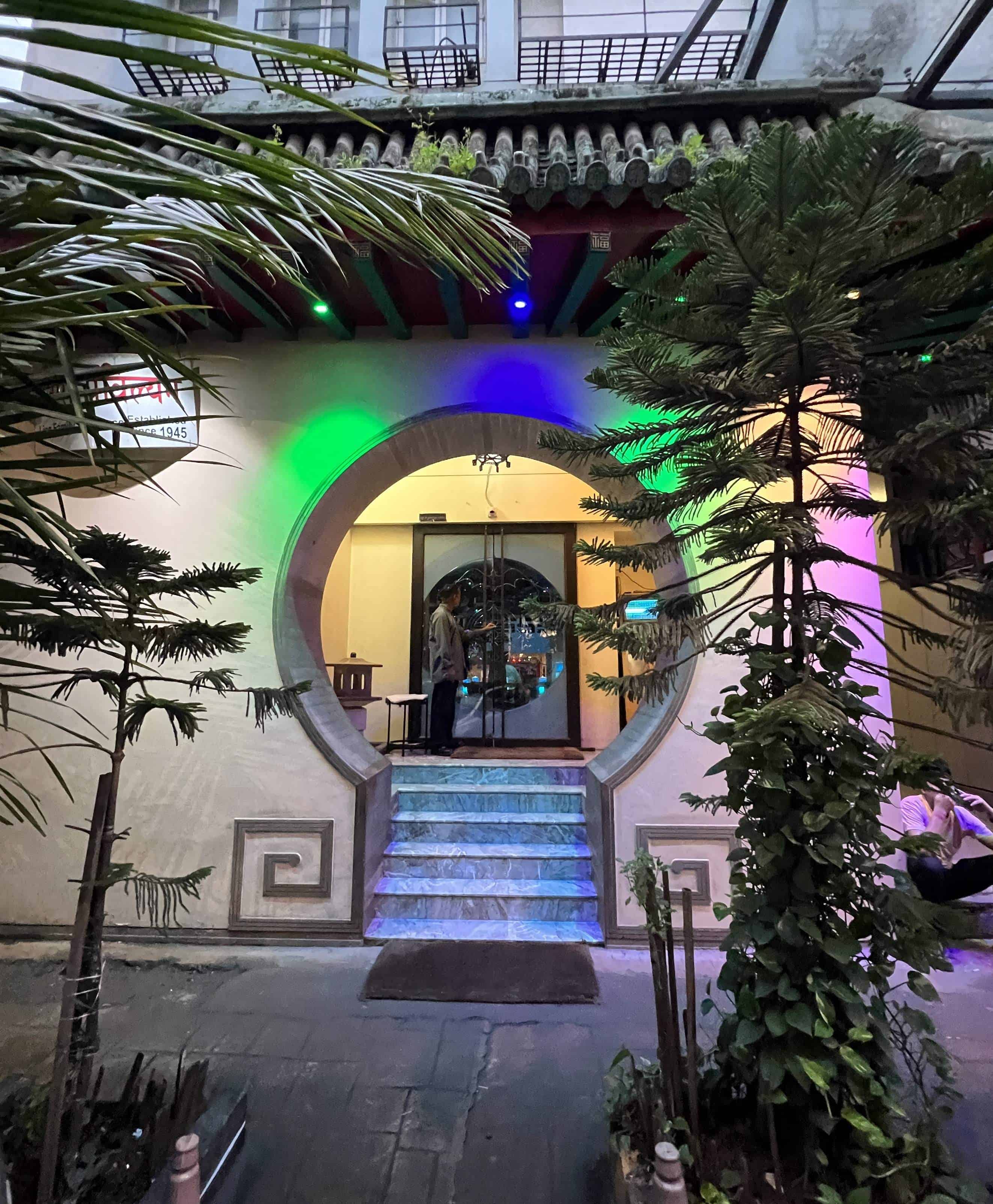 Circular entrance with colorful lights to Ling's Pavilion, a Chinese restaurant in South Mumbai.