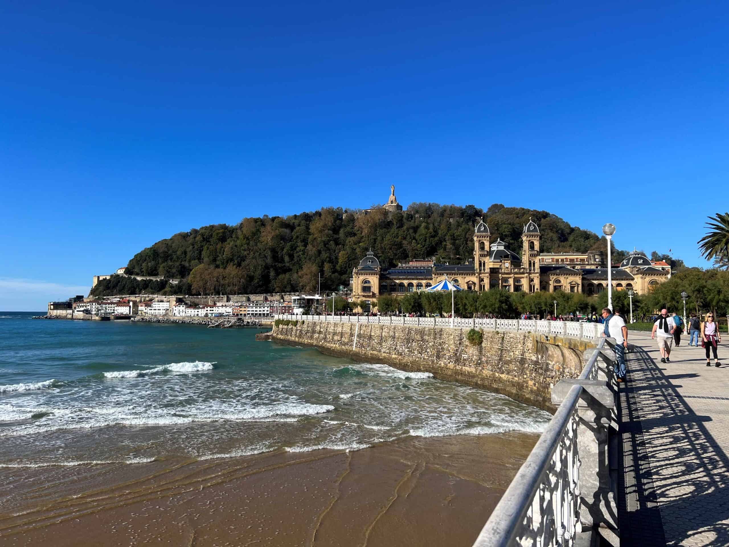 La Concha beach on the left and the city hall building in San Sebastian on the right